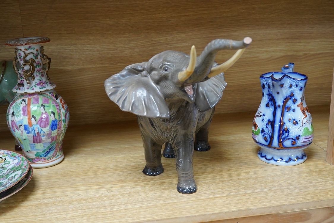 A Beswick model of an elephant and a Staffordshire jug, c.1840, largest 34cm wide